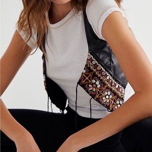 Free people leather vest with stitching. Never worn.